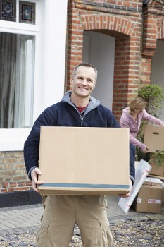 House movers working around modern Nine Elms apartment buildings