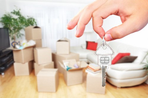 Careful loading of household items into a removals van