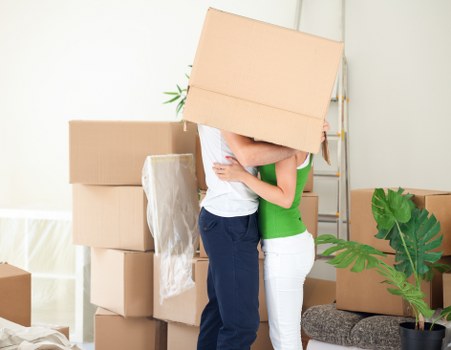 Careful unpacking and room setup in a Nine Elms home