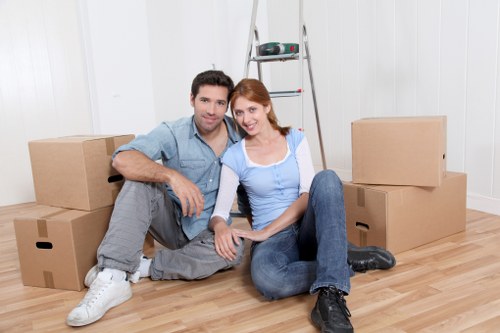 Packed moving boxes and furniture ready for transport in Nine Elms