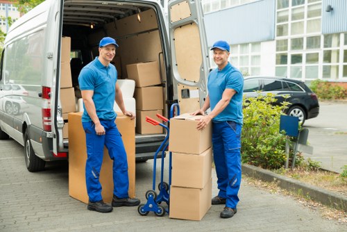 Man with van service in Nine Elms loading items carefully