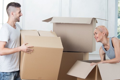Mover using PPE while loading belongings into a van