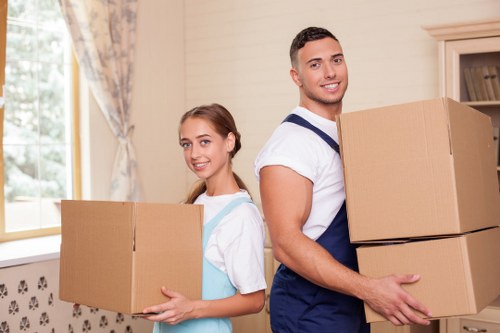 Packed boxes and furniture prepared for transport in a local removals job