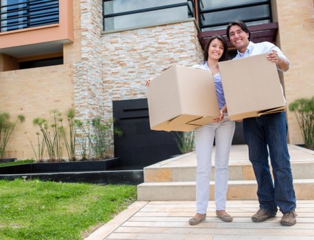 Local movers organising boxes in a Nine Elms apartment